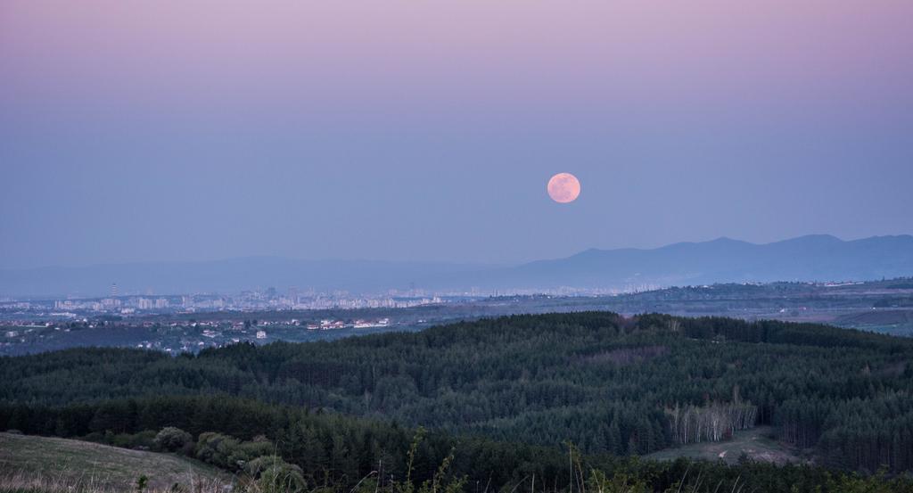 Landscape photograph The moon and Sofia in the distance. by Julius Metodiev on PhotoCodex