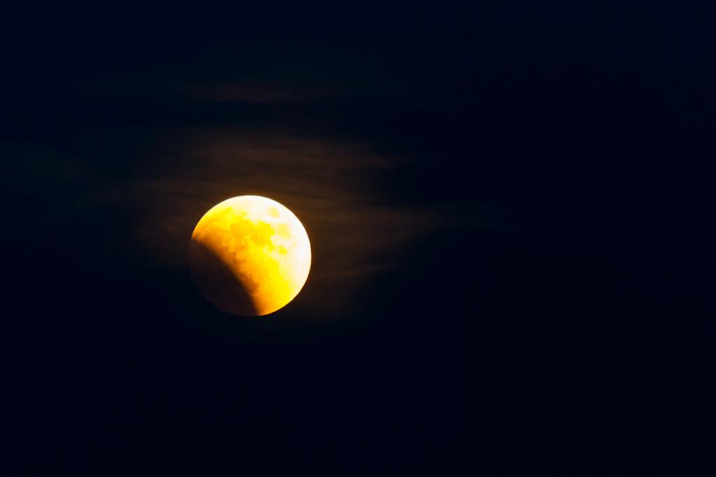 Night photograph The beginning of the June 2011 lunar eclipse. by Sergey Vasilev on PhotoCodex